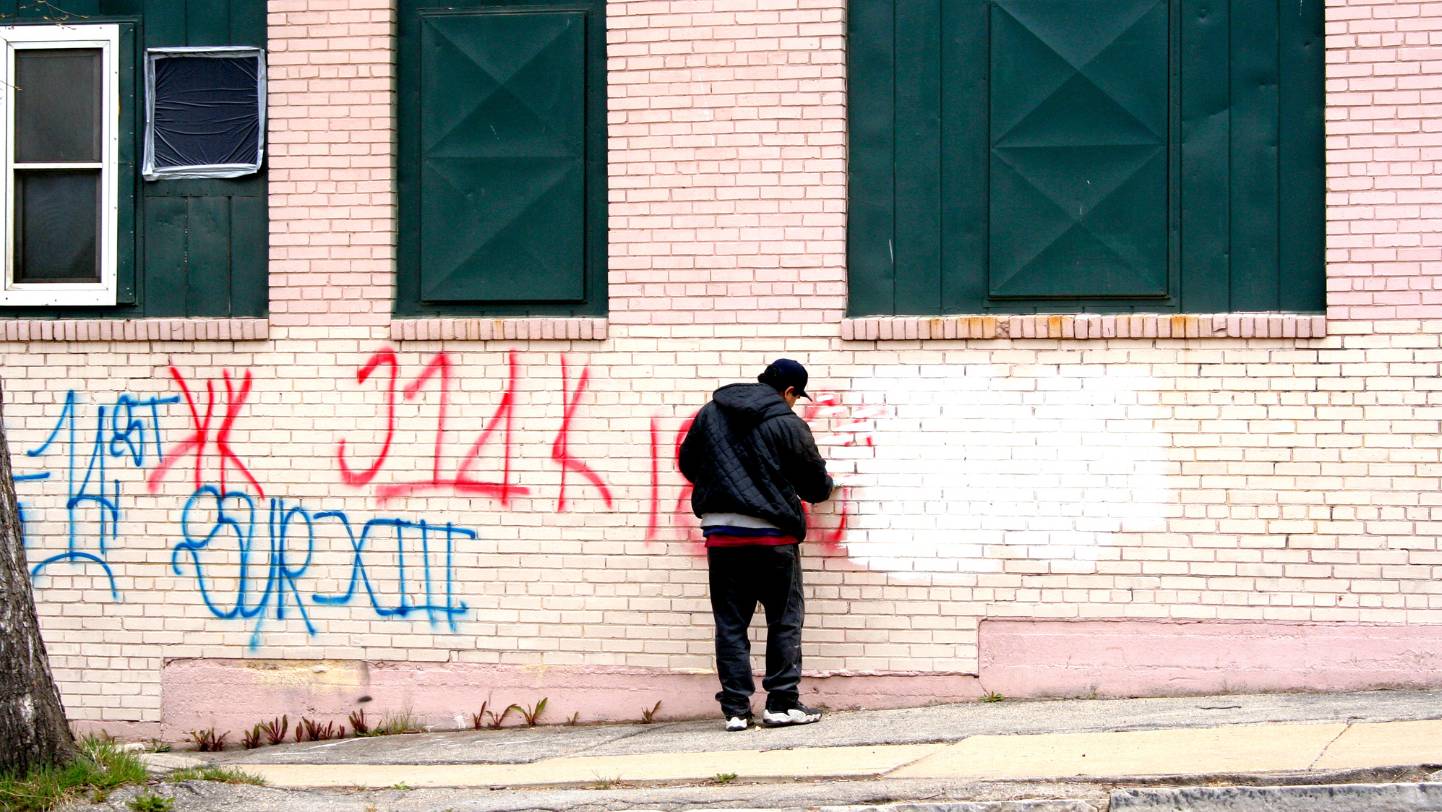 Graffiti Removal Service Being Carried Out With Pressure Washing